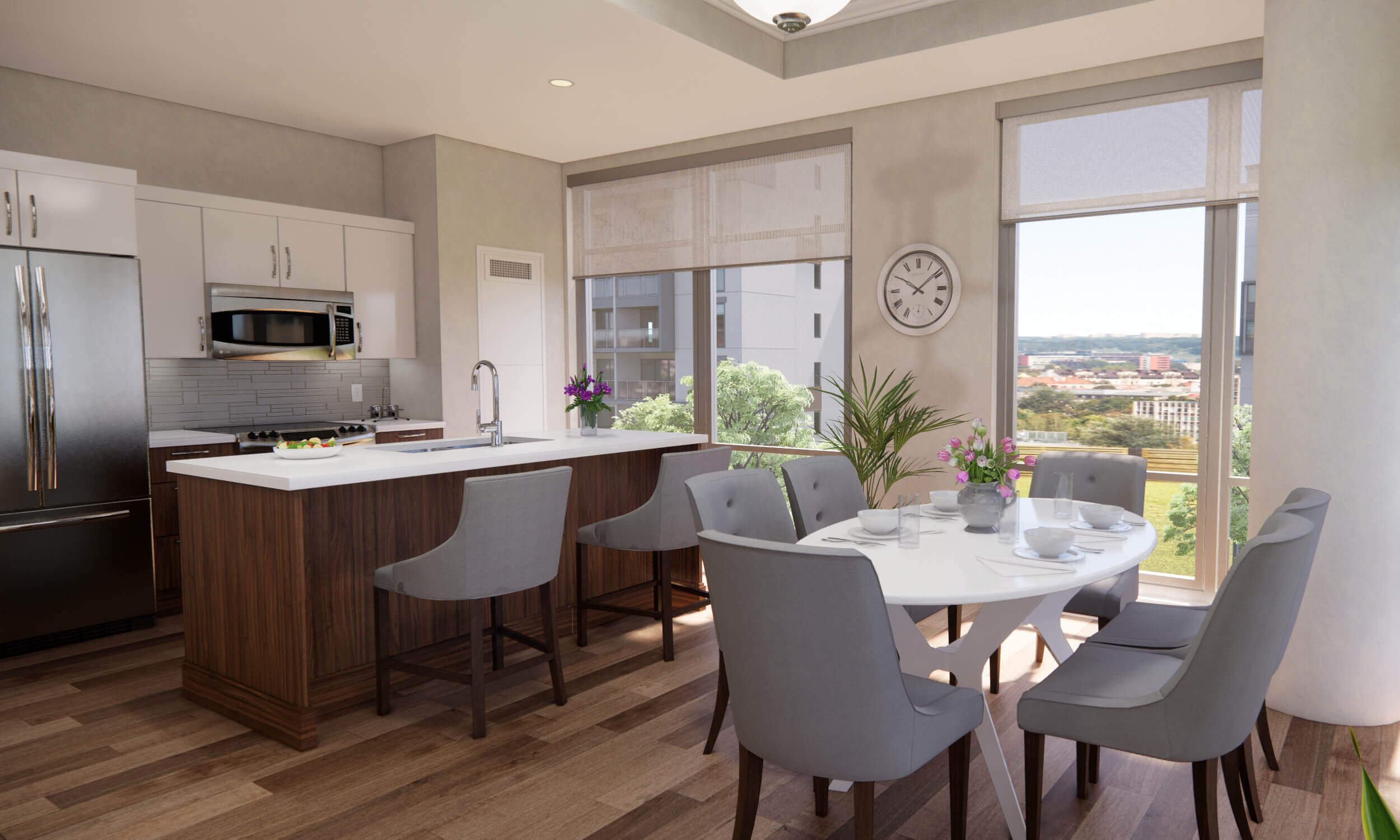 Kitchen and dining room area with white counters and grey chairs 