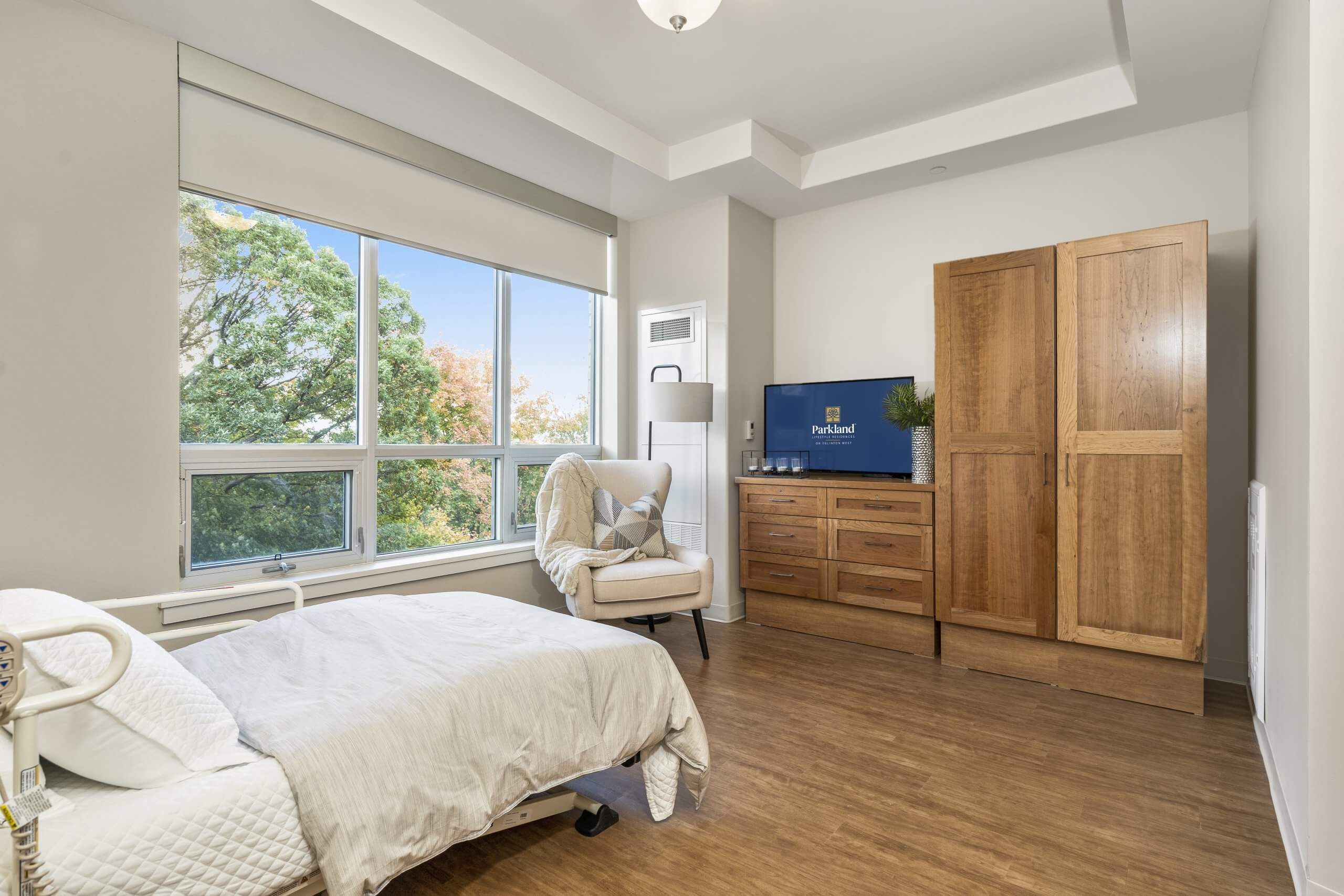 Accessible suite and bed with support rails. 